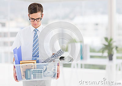 Businessman redundant with belongings in box in office Stock Photo