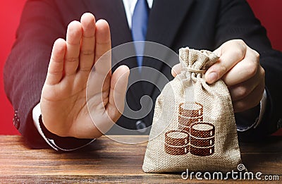 Businessman refuses to give money bag. Refusal to grant loan mortgage, bad credit history. Financial difficulties. Refuses Stock Photo