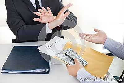 Businessman refuses to receive money that come with agreement paper - no bribery and corruption concept Stock Photo