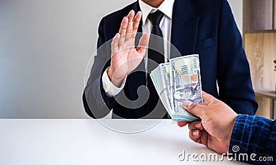 Businessman refusing money offered by his partner Stock Photo