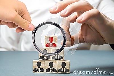 Businessman removes wooden block with worker image. The boss dismisses the employee from the team. Personnel Management. Bad Stock Photo