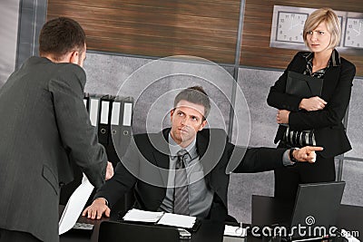 Businessman reporting to executive Stock Photo