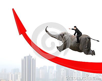 Businessman riding elephant on red arrow up trend line Stock Photo