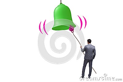 Businessman ringing the bell in case of danger Stock Photo
