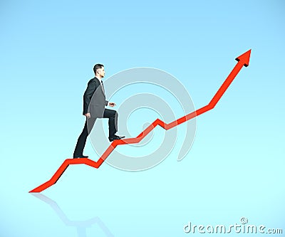 Businessman rises up a arrow Stock Photo