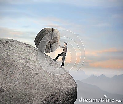 Businessman on a Rock Stock Photo