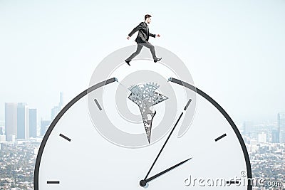Businessman runing on gear cogwheel clock Stock Photo