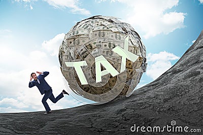 Businessman running away in tax concept Stock Photo