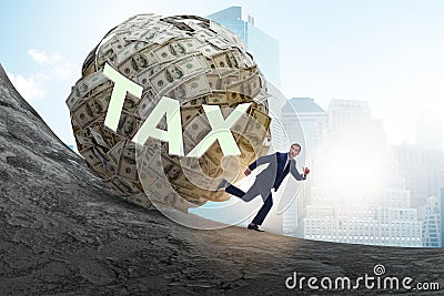 Businessman running away in tax concept Stock Photo