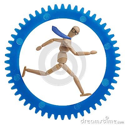 Businessman running in cogwheel Stock Photo