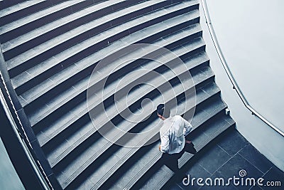 Businessman running fast upstairs Growth up Success concept Stock Photo