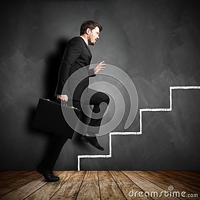 Businessman running the symbolic career stairs Stock Photo