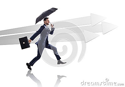 Businessman running near big gray arrows. Stock Photo