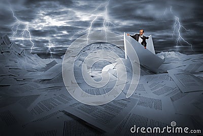 Businessman sailing in stormy papers sea Stock Photo