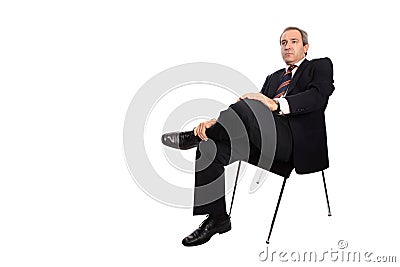 Businessman seated on a chair Stock Photo