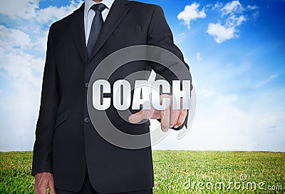 Businessman selecting coach word Stock Photo