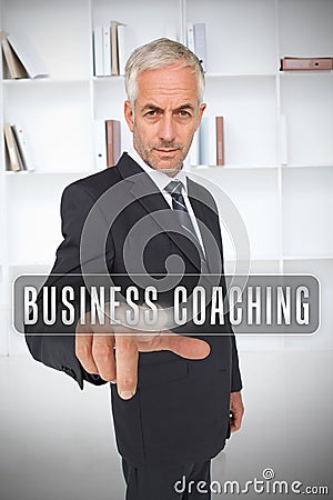 Businessman selecting the term business coaching Stock Photo