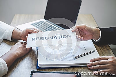 Businessman sending a resignation letter to employer boss in order to dismiss employment contract, changing and resigning from Stock Photo