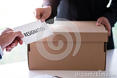 Businessman sending resignation letter to the executive employer boss on desk in order to resign dismiss contract, job placement Stock Photo