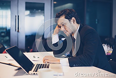 Businessman serious about the work hard done until the headache Stock Photo