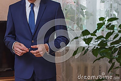 Businessman setting the tie straight Stock Photo