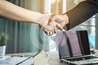 Businessman /shaking hands with client / customer after negotiation are agreed and contract signed Stock Photo