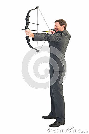 Businessman shooting a bow and arrow Stock Photo