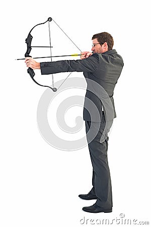 Businessman shooting a bow and arrow Stock Photo