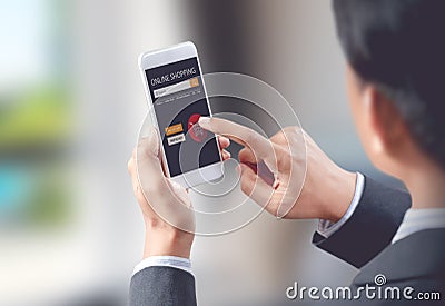 Businessman shop online on mobile with shopping cart Stock Photo