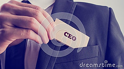 Businessman showing a card reading CEO Stock Photo