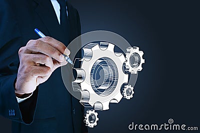 Businessman showing gears cogs to success concept Stock Photo