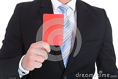 Businessman showing red card Stock Photo
