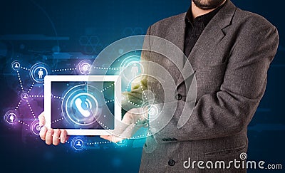Businessman showing social networking technology with colorful l Stock Photo