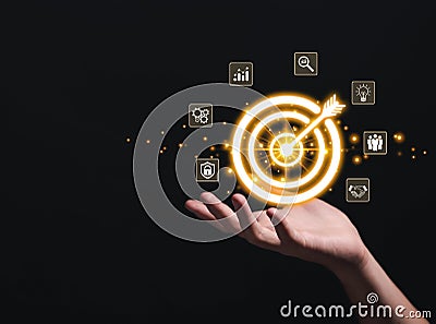 Businessman showing target arrow virtual digital technology icon on board, business investment concept, objectives and goals Stock Photo