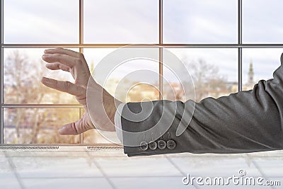 Businessman shows attacking claw hand in the office Stock Photo