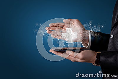 Businessman shows the plus sign appearing from the phone on the network Stock Photo