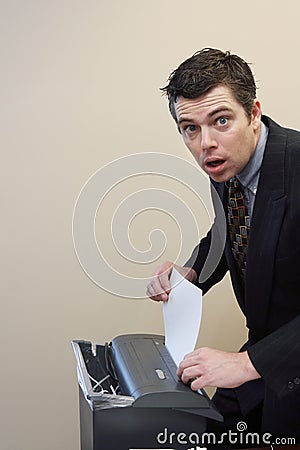 Businessman Shredding Documents Stock Photo