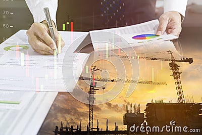 Businessman signing a building construction contract Stock Photo