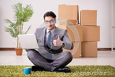 The businessman sitting on the carpet in office Stock Photo