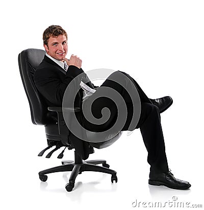 Businessman Sitting on Chair Stock Photo