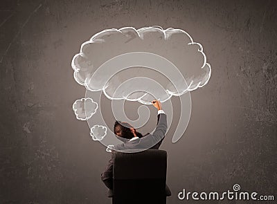 Businessman sitting with cloud thought above his head Stock Photo