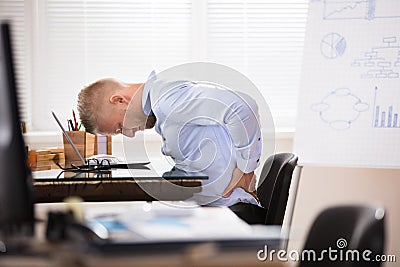 Businessman Having Back Pain Stock Photo