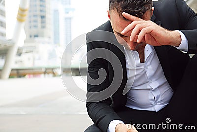 Businessman sitting sadness and thinking for work. Stock Photo