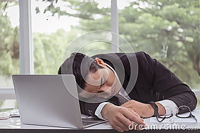 Businessman sleeping in office. Stock Photo