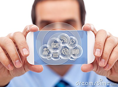Businessman with smart gadget accessing cloud applications Stock Photo