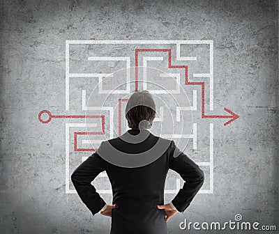 Businessman solves complicated maze Stock Photo