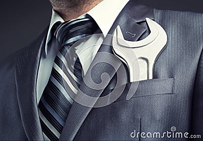Businessman with spanner Stock Photo