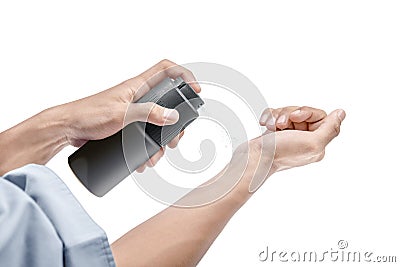 Businessman spraying perfume on his hands Stock Photo