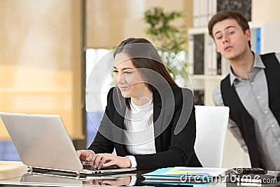 Businessman spying his colleague at job Stock Photo