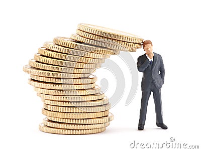 Businessman and stack of coins Stock Photo